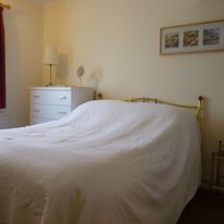 The double bedroom: also light and airy, the rear bedroom has a double bed, plenty of wardrobe space and drawers